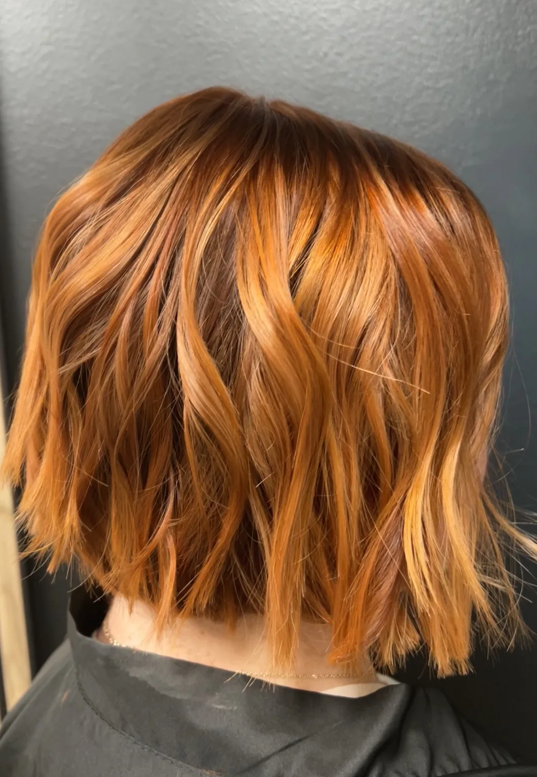Vibrant copper red bob hair color